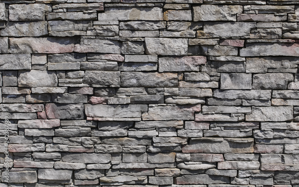 Naklejka Dekoracyjny wzór powierzchni kamiennej ściany. Kamienna tekstura tła