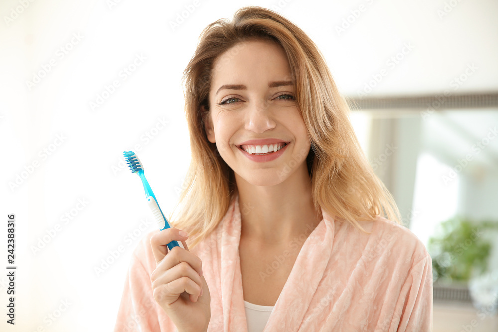 Portrait of young woman with toothbrush in bathroom. Personal hygiene Portrait of young woman with toothbrush in bathroom. Personal hygiene