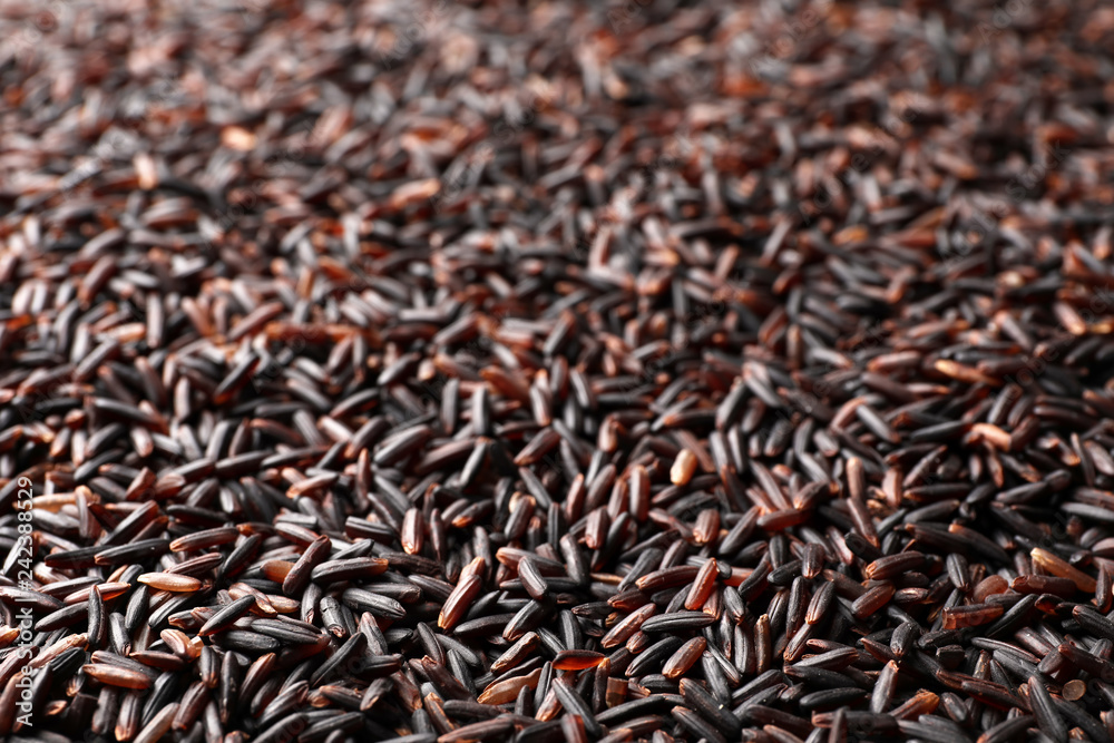 Raw brown rice as background, closeup view