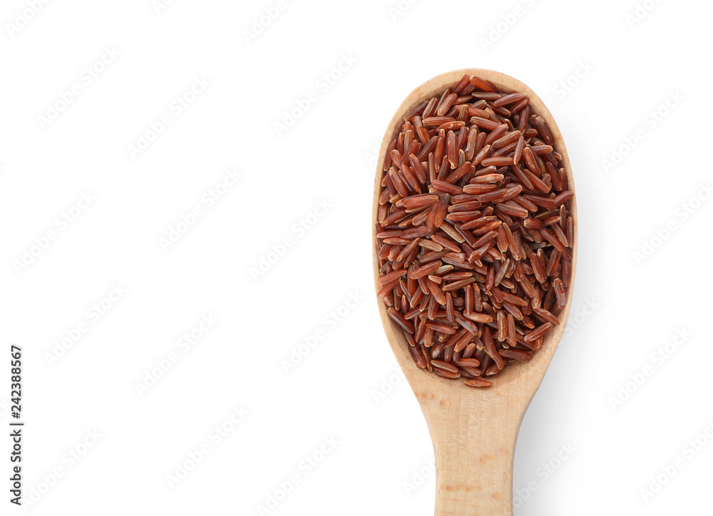 Wooden spoon with brown rice on white background, top view Wooden spoon with brown rice on white background, top view