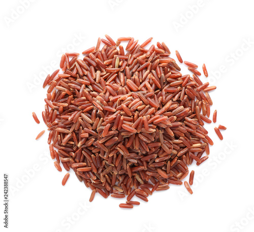 Pile of brown rice on white background, top view