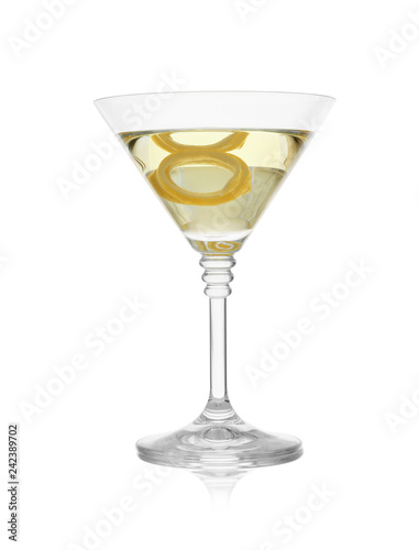 Glass of martini cocktail with lemon zest on white background