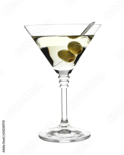 Glass of classic martini cocktail with olives on white background