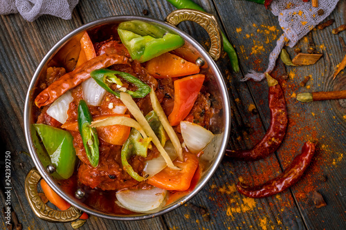 kadai chicken indian food or indian curry on wooden background photo