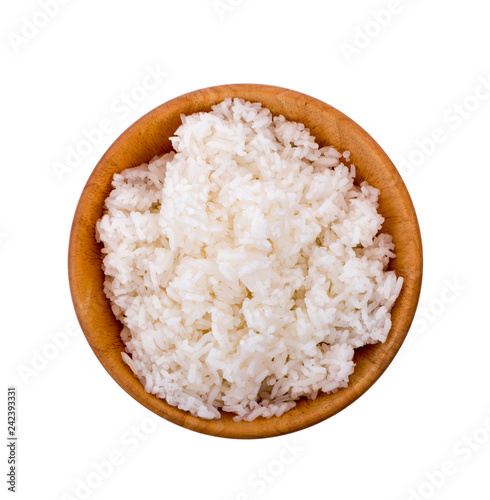 rice in a wooden bowl isolated on white background. Top view