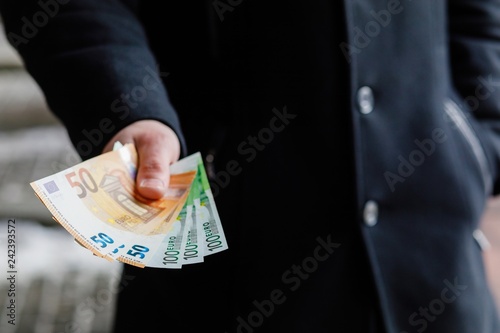 Euro Money. paper Euro banknotes in man hand.