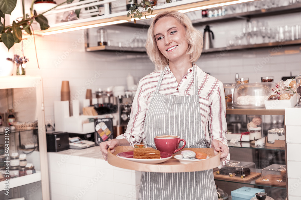 Positive joyful woman working as a waitress Positive joyful woman working as a waitress
