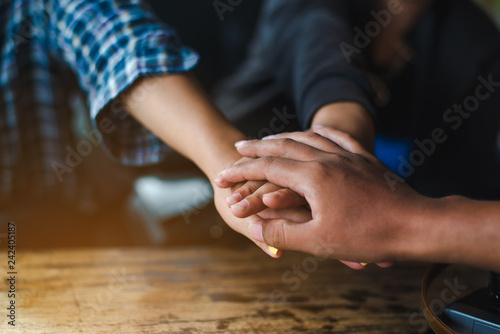 Business partnership of people holding hands together while working teamwork  Close up of three  hand gesture  symbol of common celebration or greeting. Success and teamwork concept copy space