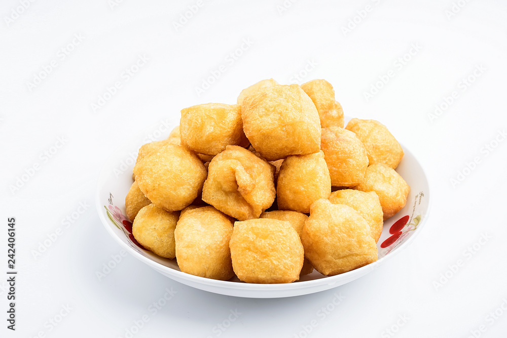 Golden oil tofu on white background