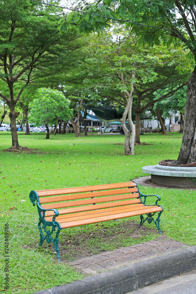 Green chairs in the public park. Feel lonely and peaceful. Green chairs in the public park. Feel lonely and peaceful.