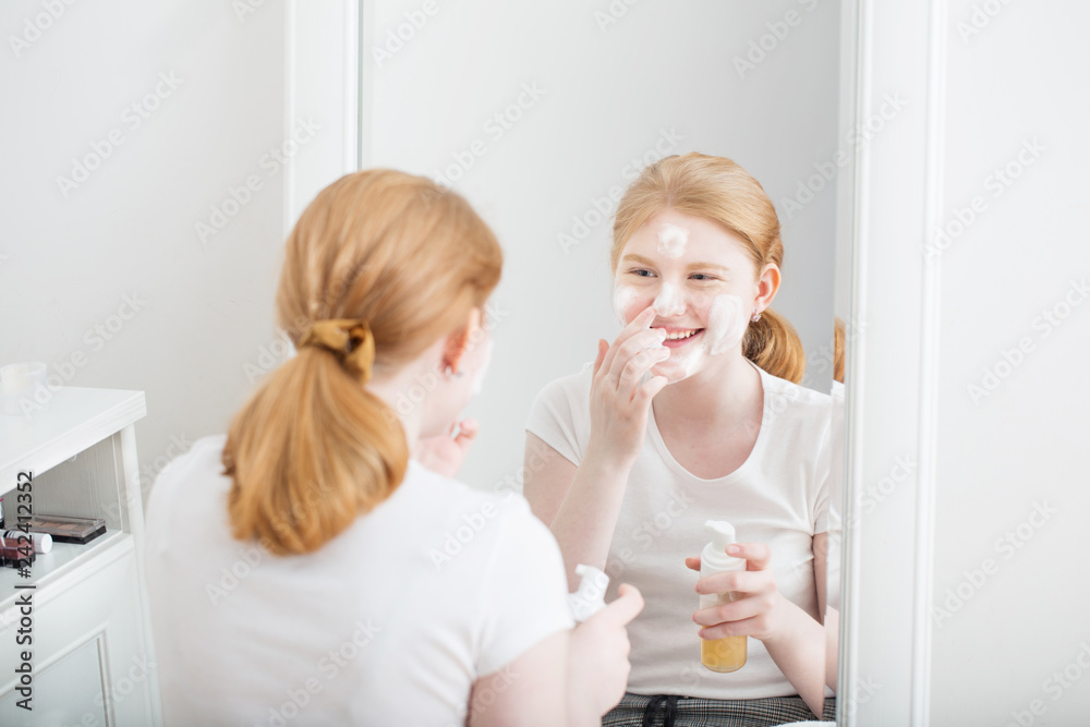 teen girl puts on  face mask
