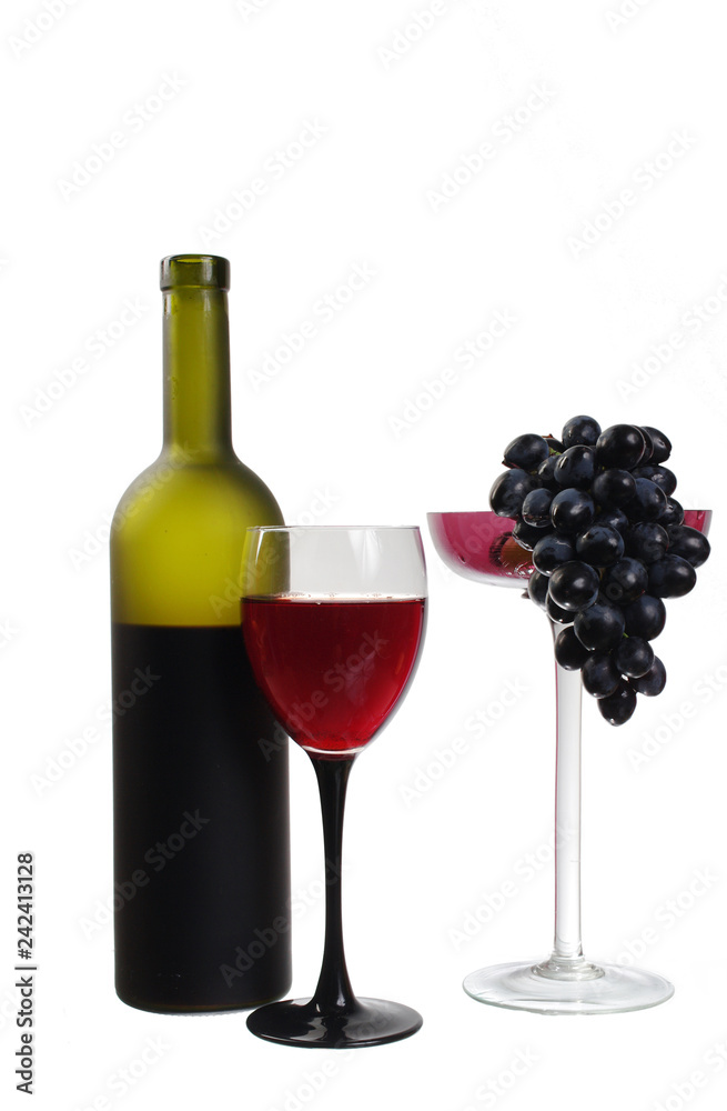 A glass of red wine, a bottle, a bunch of grapes and a red rose