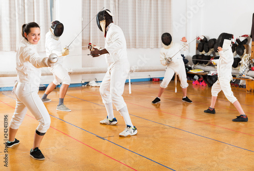 Woman training fencing movements