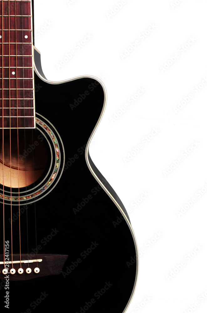 Fototapeta premium Acoustic guitar on a white background. Close-up