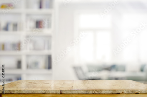 Empty wooden desk table in living room background photo