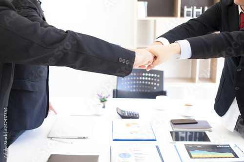 Business people join hands symbol of strong teamwork