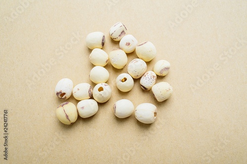 White lotus seed/Chinese medicine health soup background material on yellow paper