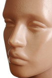 Male plastic mannequin. Face. Close-up. On a white background