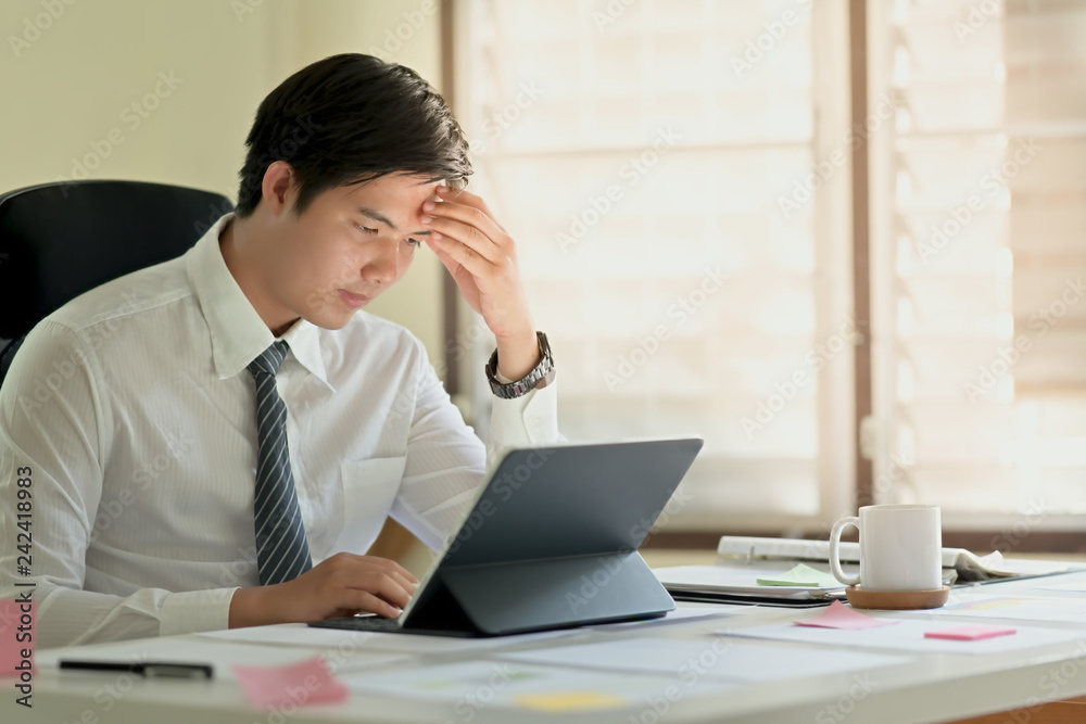 Portrait shot of stressed business  Asian man in the office