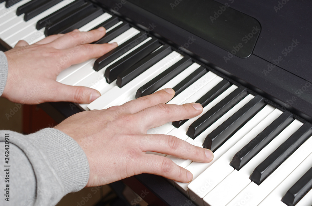Hands pianist playing the keyboard Hands pianist playing the keyboard