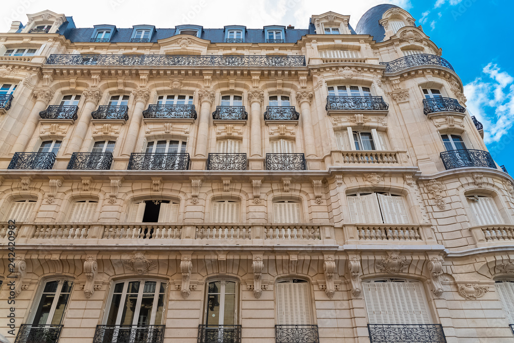     Paris, beautiful building in winter, typical parisian facade in the Marais, view from the square du Temple 
