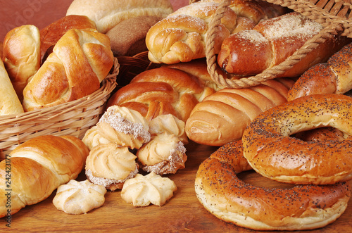 Bakery products. Loaves, rolls, loaves of bread on a wooden table