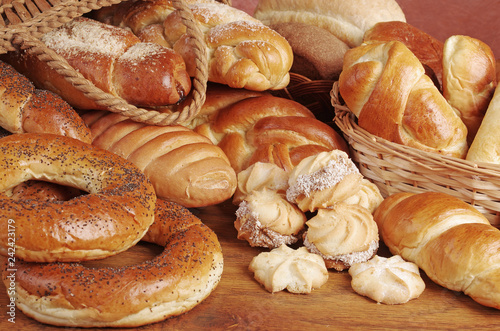 Bakery products. Loaves, rolls, loaves of bread on a wooden table