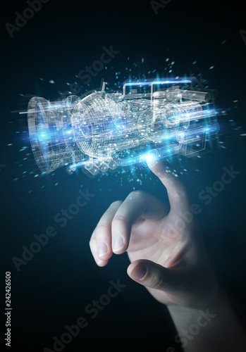 Businesswoman using wireframe holographic 3D digital projection of an engine