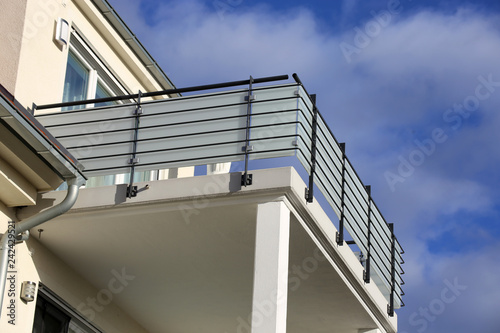 Large balcony with railing made of glass and stainless steel