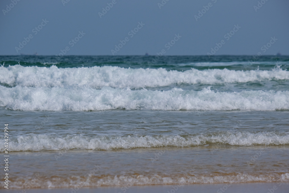 Beautiful waves in the sea, amazing nature beach background. Royalty high-quality stock photo image ocean water, sea surface, sand. Turquoise waves, clear water surface background for tex and design