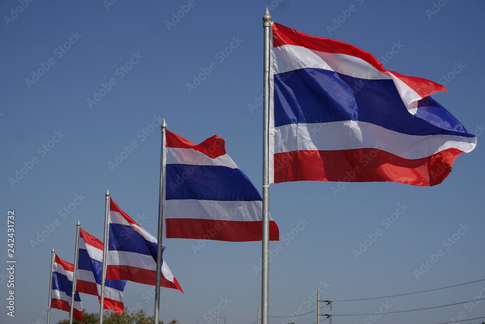 Thai national flags flying in the wind.