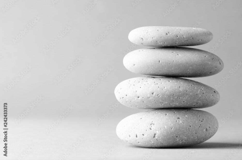 Fototapeta Stack of grey massage stones