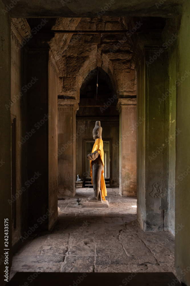 Buddha statue standing in Angkor Wat hall