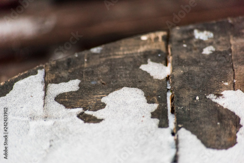 White snow on the old wooden table