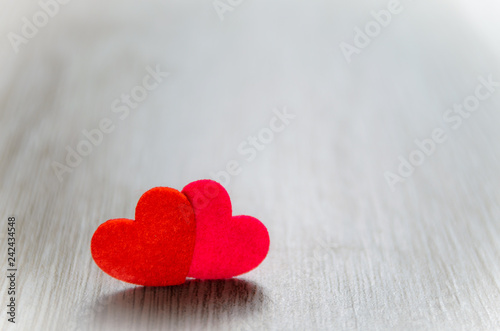 Two red heart on the gray background
