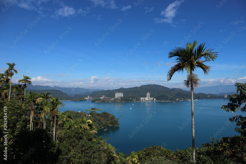Beautiful landscape view of mountain and lake with reflection in the morning under sky and cloud, Nantou, Taiwan