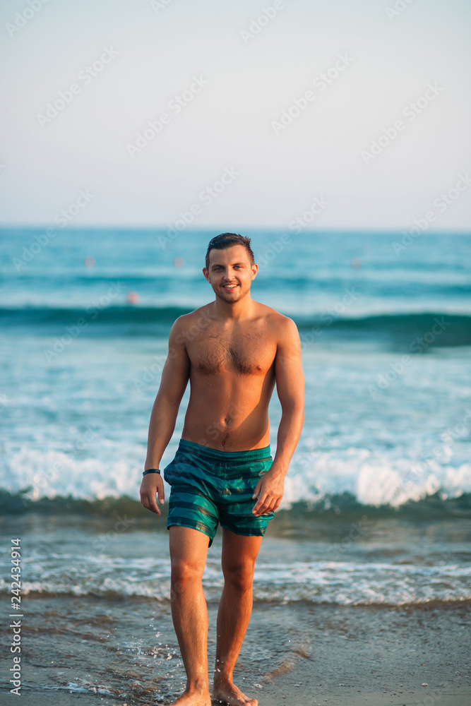 Portrait of an attractive young man on a tropical beach Portrait of an attractive young man on a tropical beach