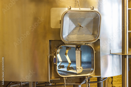 Window into the machine for mixing beer wort in the brewery.