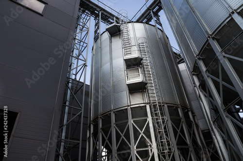 Wallpaper Mural Exterior of Agricultural Silo building with storage tanks for agricultural crops processing plant, drying of grains, rape, wheat, corn, soy, sunflower. Torontodigital.ca