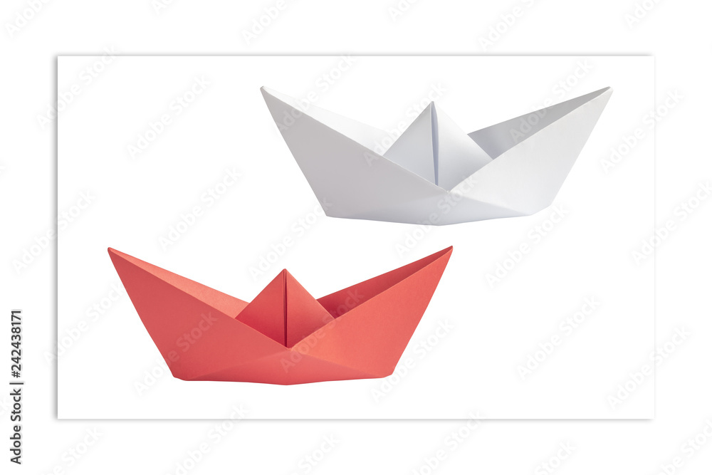 Origami. White and red ships opposite each other. The concept of minimalism.