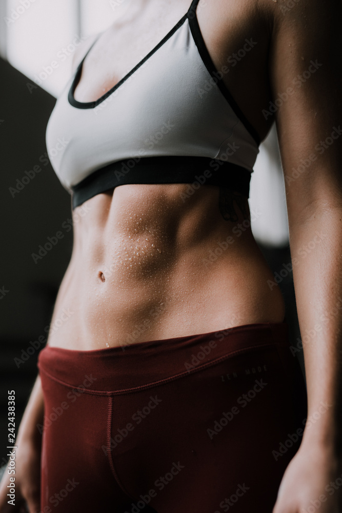 Sixpack abs young girl Fitness