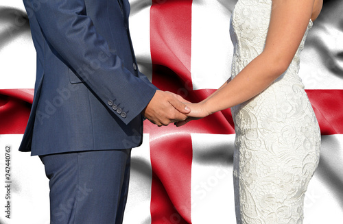 Husband and Wife holding hands - Conceptual photograph of marriage in England