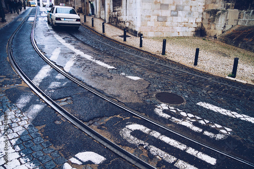 RAILES Y SUELO ADOQUINADO EN CALLE DE LISBOA EN PORTUGAL photo