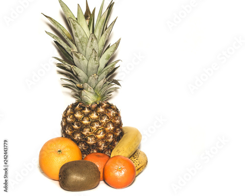 Fototapeta Naklejka Na Ścianę i Meble -  tropical fruits bananas, orange, mandarin, kiwi, pineapple isolated on white background