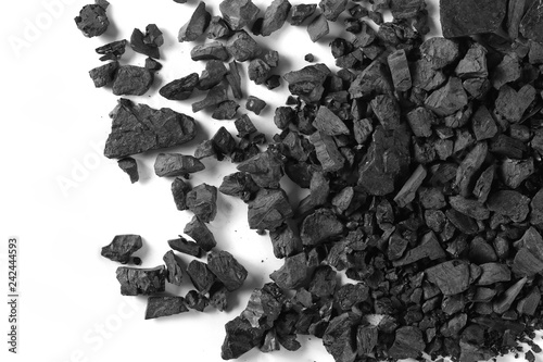 Black coal pile isolated on white background, top view