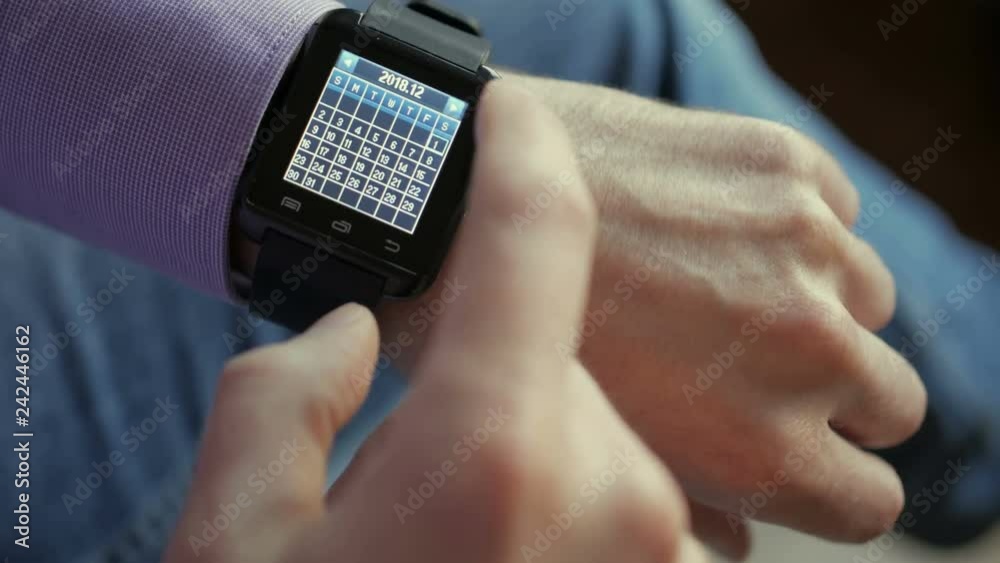 Man Using Calendar App Smart Watch to Check Schedule. Close up