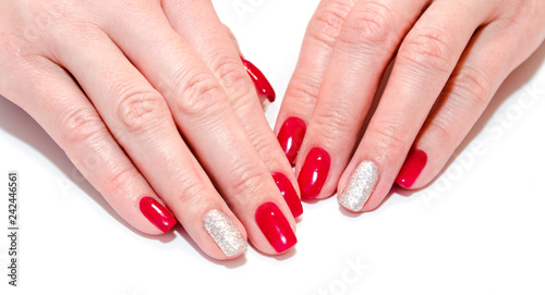 Woman s nails with beautiful red manicure fashion design with gems isolated