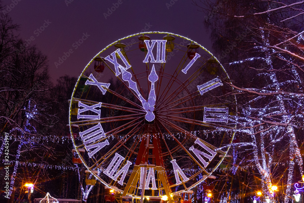 glowing clock in the Park on the Ferris wheel