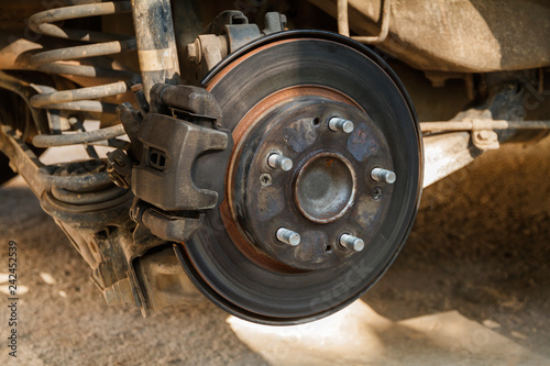 Disc brake of the vehicle for repair,  Car brake repairing in garage.Close up view. © Freely
