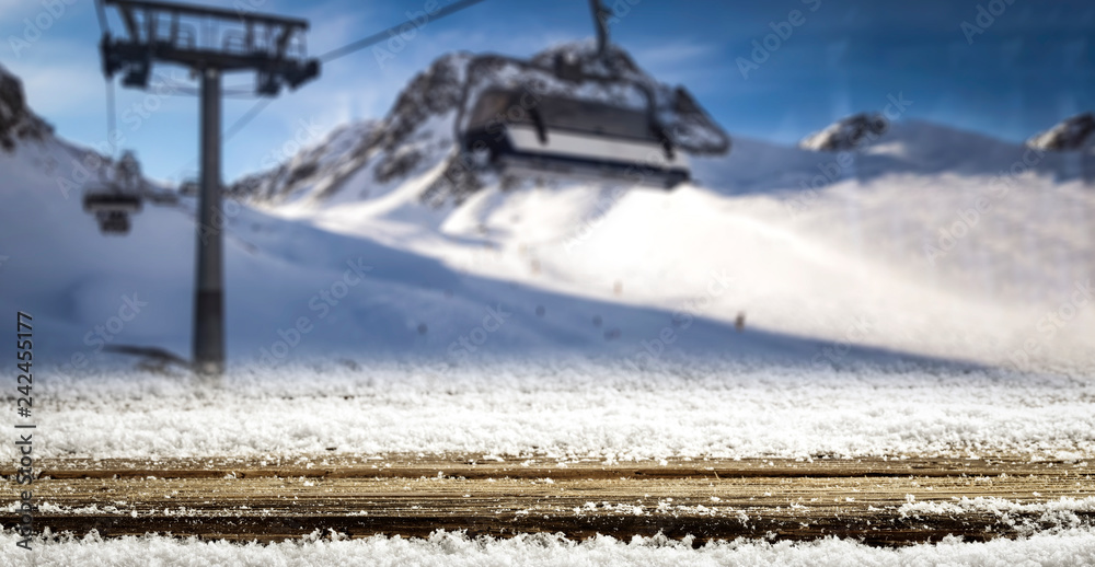 Desk with snow and frost with Alps mountains landscape Desk with snow and frost with Alps mountains landscape